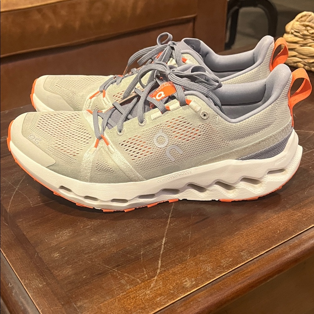 On Running Light Gray and Bright Orange Shoes - cloudsurfer trail